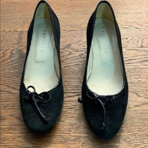 Black suede wedge pumps